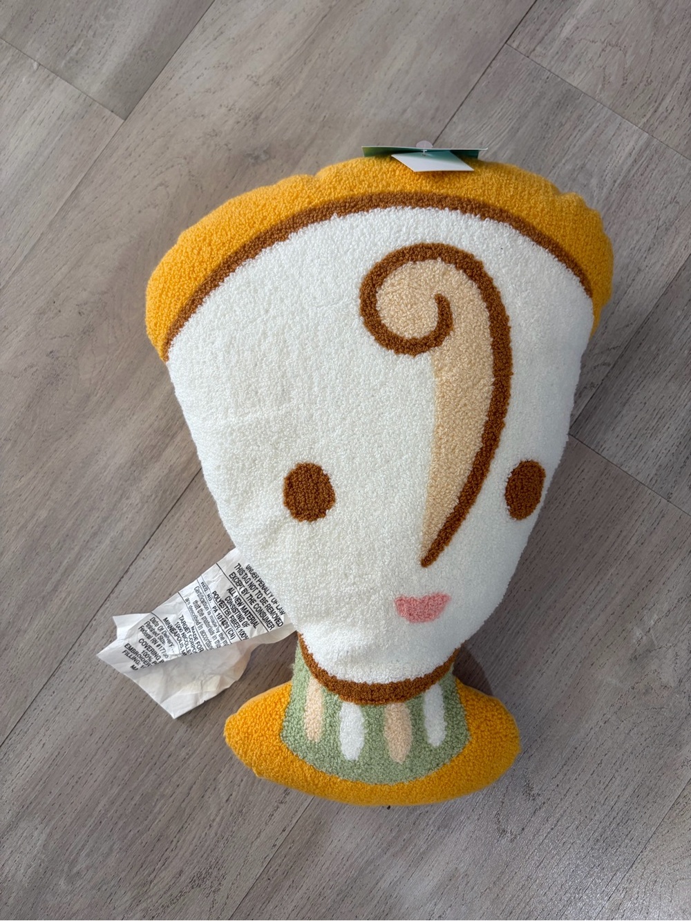Beauty and the beast’s Chip Tea Cup-Textured Accent Pillow in White and Mustard